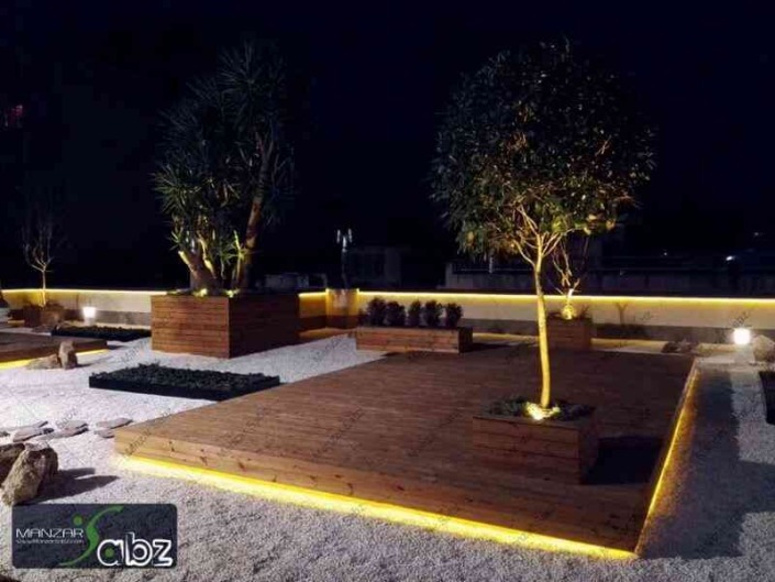 عکسی از پروژه تراس سبز شیرین در حال نمایش گیاهان بیرون پروژه در شب